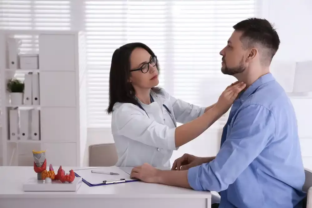 man getting thyroid testing