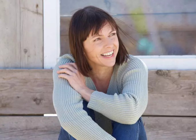 woman smiling outside