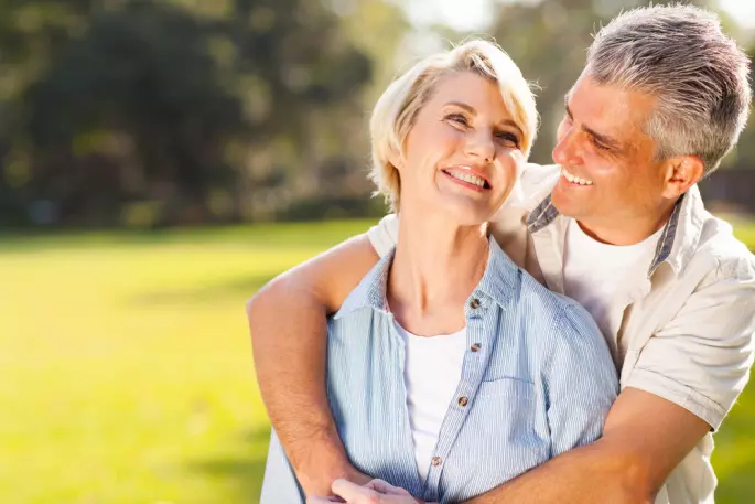 smiling couple outside