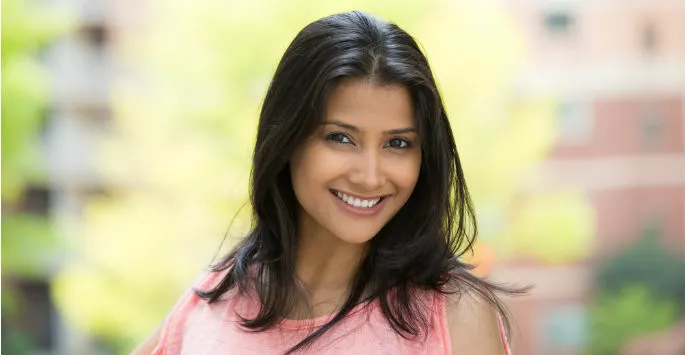 smiling woman after getting her wellness plan