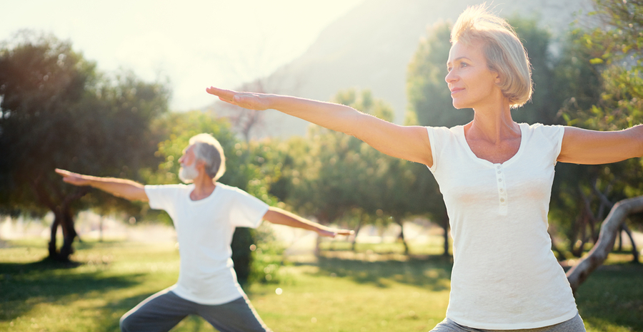 couple doing yoga outside